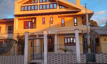 Casa com 4 quartos à venda na Avenida Vasco Alves Pereira, 6, Morada da Colina, Guaíba, 106 m2 por R$ 980.000