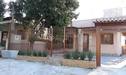 Casa em condomínio fechado com 3 quartos à venda na Avenida Maurício Sirostsky Sobrinho, 577, Morada da Colina, Guaíba, 126 m2 por R$ 400.000