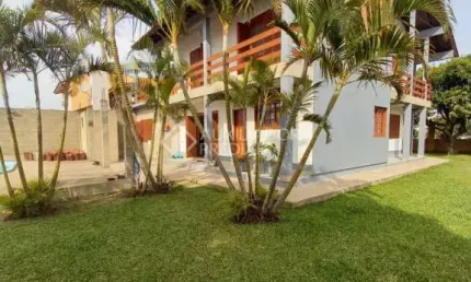 Casa em condomínio fechado com 4 quartos à venda na Avenida Maurício Lessa, 535, Flórida, Guaíba, 306 m2 por R$ 840.000