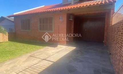 Casa em condomínio fechado com 3 quartos à venda na Rua Coronel Inácio de Quadros, 1171, Coronel Nassuca, Guaíba, 230 m2 por R$ 430.000