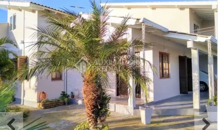 Casa em condomínio fechado com 3 quartos à venda na Rua Josué Guimarães, 695, Jardim dos Lagos, Guaíba, 170 m2 por R$ 580.000
