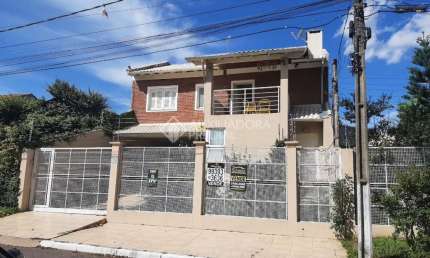 Casa em condomínio fechado com 3 quartos à venda na Rua das Timbaúvas, 76, Igara, Canoas, 280 m2 por R$ 1.600.000