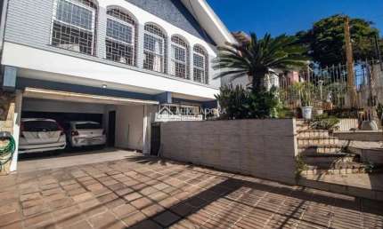 Casa com 3 quartos à venda na Rua Paulino Chaves, 427, Santo Antônio, Porto Alegre, 250 m2 por R$ 1.100.000