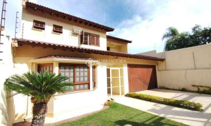 Casa com 4 quartos à venda na Rua Alfredo Silveira Dias, 15, Nonoai, Porto Alegre, 350 m2 por R$ 1.080.000
