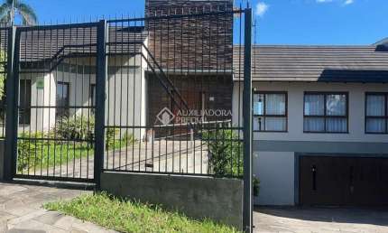 Casa em condomínio fechado com 4 quartos à venda na Rua Cambará, 824, Viamópolis, Viamão, 408 m2 por R$ 1.500.000