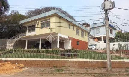 Casa em condomínio fechado com 3 quartos à venda na Rua Engenheiro Leovegildo Paiva, 73, Santa Tereza, Porto Alegre, 306 m2 por R$ 699.000