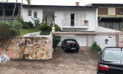 Casa com 3 quartos à venda na Rua Araponga, 174, Chácara das Pedras, Porto Alegre, 247 m2 por R$ 1.900.000