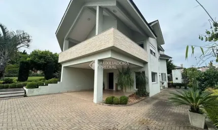 Casa em condomínio fechado com 3 quartos à venda na Estrada Capitão Gentil Machado de Godoy, 4500, Vila Elsa, Viamão, 357 m2 por R$ 1.620.000
