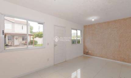 Casa em condomínio fechado com 3 quartos à venda na Rua dos Guaramirins, 303, Igara, Canoas, 164 m2 por R$ 456.000