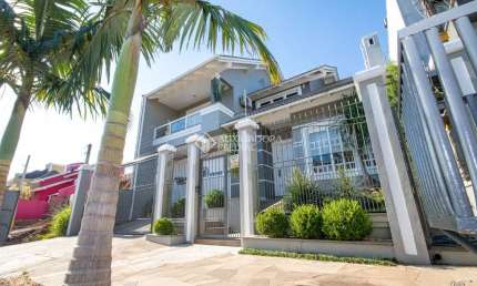 Casa com 3 quartos à venda na Rua Dinamarca, 268, Marechal Rondon, Canoas, 276 m2 por R$ 1.599.000