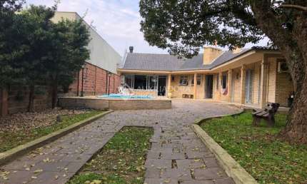 Casa em condomínio fechado com 5 quartos à venda na Rua Bagé, 623, Niterói, Canoas, 235 m2 por R$ 1.250.000