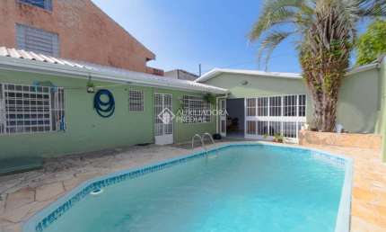 Casa em condomínio fechado com 3 quartos à venda na Rua Pistoia, 864, Rio Branco, Canoas, 220 m2 por R$ 599.000