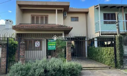 Casa em condomínio fechado com 3 quartos à venda na Rua Felipe de Oliveira, 85, Harmonia, Canoas, 176 m2 por R$ 399.000