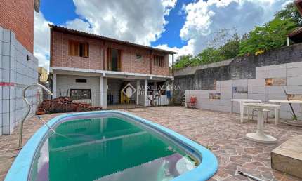 Casa com 3 quartos à venda na Rua Álvaro Nicofé, 150, Vila Jardim, Porto Alegre, 528 m2 por R$ 550.000