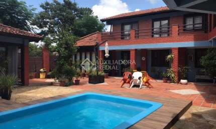 Casa em condomínio fechado com 4 quartos à venda na Rua Walter Kaufmann, 6, Jardim Itu Sabará, Porto Alegre, 357 m2 por R$ 1.600.000