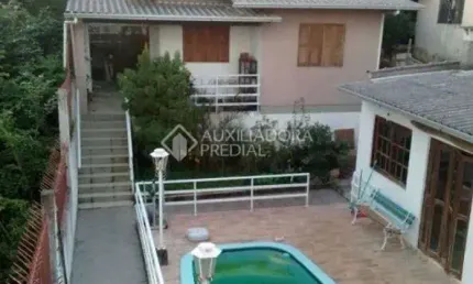 Casa com 3 quartos à venda na Rua Ângelo Passuelo, 330, Vila Nova, Porto Alegre, 570 m2 por R$ 650.000
