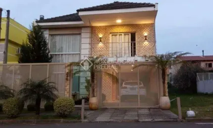 Casa em condomínio fechado com 3 quartos à venda na Rua Ronaldo Molina de Quadros, 330, Mário Quintana, Porto Alegre, 266 m2 por R$ 1.090.000