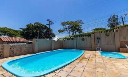 Casa em condomínio fechado com 3 quartos à venda na Rua Humberto de Campos, 601, Partenon, Porto Alegre, 96 m2 por R$ 430.000