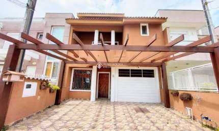 Casa em condomínio fechado com 3 quartos à venda na Rua Guatambu, 106, Hípica, Porto Alegre, 209 m2 por R$ 650.000