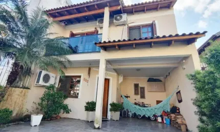 Casa em condomínio fechado com 3 quartos à venda na Rua Pau Brasil, 329, Hípica, Porto Alegre, 140 m2 por R$ 580.000