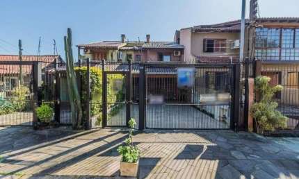 Casa com 3 quartos à venda na Rua Olécio Cavedini, 45, Espírito Santo, Porto Alegre, 165 m2 por R$ 640.000