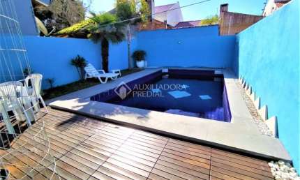 Casa em condomínio fechado com 3 quartos à venda na Rua Carlos Scliar, 99, Hípica, Porto Alegre, 183 m2 por R$ 696.900