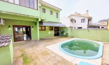 Casa em condomínio fechado com 3 quartos à venda na Rua Louro, 34, Hípica, Porto Alegre, 167 m2 por R$ 650.000