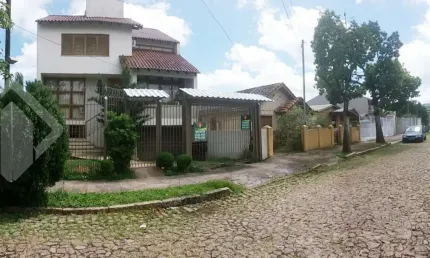 Casa em condomínio fechado com 3 quartos à venda na Rua Olécio Cavedini, 121, Espírito Santo, Porto Alegre, 300 m2 por R$ 890.000