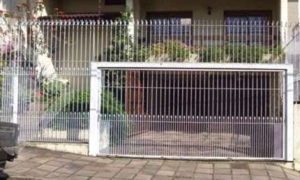 Casa em condomínio fechado com 3 quartos à venda na Rua João Bonuma, 48, Coronel Aparício Borges, Porto Alegre, 326 m2 por R$ 1.200.000