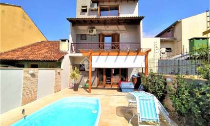 Casa com 3 quartos à venda na Rua Romano Rolando Botin, 155, Hípica, Porto Alegre, 141 m2 por R$ 689.000