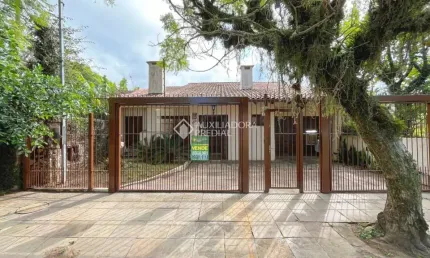Casa com 3 quartos à venda na Avenida Ararangua, 126, Guarujá, Porto Alegre, 210 m2 por R$ 425.000