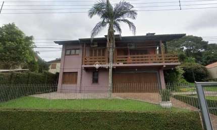 Casa com 4 quartos à venda na Rua Tubarão, 433, Primavera, Novo Hamburgo, 267 m2 por R$ 790.000