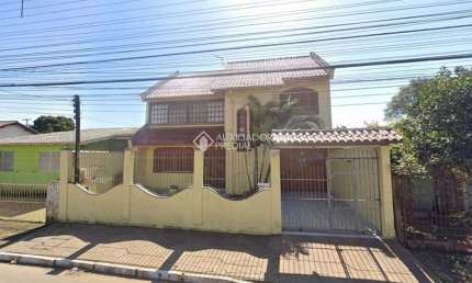 Casa em condomínio fechado com 3 quartos à venda na Rua Buttenbender, 905, Fátima, Canoas, 244 m2 por R$ 779.900