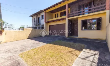 Casa em condomínio fechado com 3 quartos à venda na Avenida Ipê, 298, Vila Jardim, Porto Alegre, 192 m2 por R$ 900.000