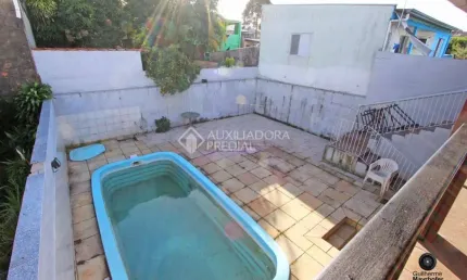 Casa com 3 quartos à venda na Rua Ovídio Moraes Leal, 70, Rubem Berta, Porto Alegre, 260 m2 por R$ 499.000