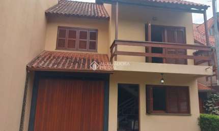 Casa em condomínio fechado com 3 quartos à venda na ORLEANS, 105, Guarujá, Porto Alegre, 207 m2 por R$ 435.000