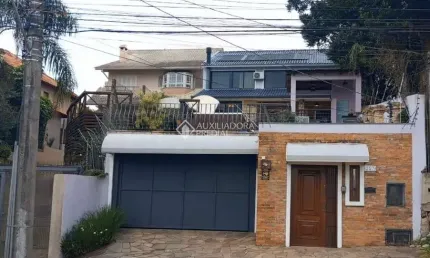 Casa em condomínio fechado com 3 quartos à venda na Rua Charruas, 257, Espírito Santo, Porto Alegre, 390 m2 por R$ 1.750.000