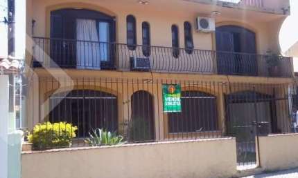 Casa em condomínio fechado com 4 quartos à venda na Rua Márcio Dias, 340, Nonoai, Porto Alegre, 450 m2 por R$ 700.000
