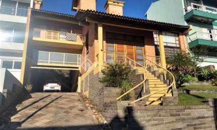 Casa em condomínio fechado com 4 quartos à venda na Rua Alcebíades Antônio dos Santos, 356, Nonoai, Porto Alegre, 495 m2 por R$ 2.500.000