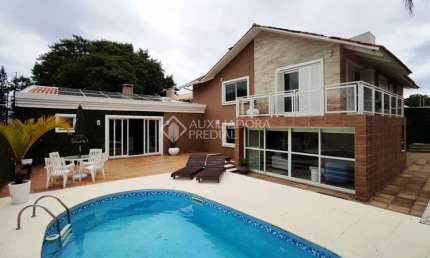 Casa com 3 quartos à venda na Rua Jacundá, 273, Guarujá, Porto Alegre, 270 m2 por R$ 1.046.000