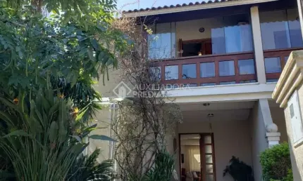Casa em condomínio fechado com 3 quartos à venda na Avenida Eduardo Prado, 2050, Cavalhada, Porto Alegre, 300 m2 por R$ 960.000