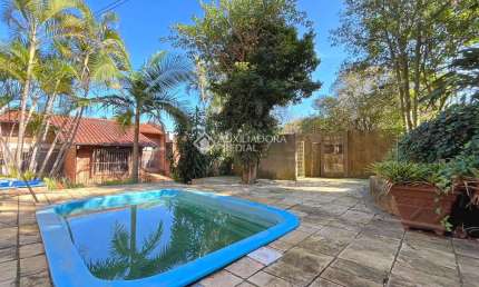 Casa com 3 quartos à venda na Rua Edgar Luiz Schneider, 490, Jardim Isabel, Porto Alegre, 350 m2 por R$ 1.290.000