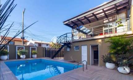 Casa com 4 quartos à venda na Rua Criciúma, 115, Guarujá, Porto Alegre, 288 m2 por R$ 1.500.000