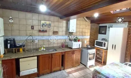 Casa em condomínio fechado com 3 quartos à venda na Avenida Juca Batista, 1490, Cavalhada, Porto Alegre, 122 m2 por R$ 650.000