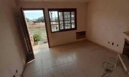 Casa com 3 quartos à venda na Rua Waldemar da Silva Tavares, 210, Guarujá, Porto Alegre, 108 m2 por R$ 450.000