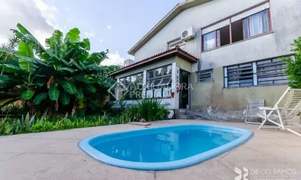 Casa em condomínio fechado com 3 quartos à venda na Rua Cariri, 46, Vila Assunção, Porto Alegre, 284 m2 por R$ 1.380.000