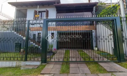 Casa com 3 quartos à venda na Rua Doutor Egydio Michaelsen, 250, Cavalhada, Porto Alegre, 292 m2 por R$ 960.000