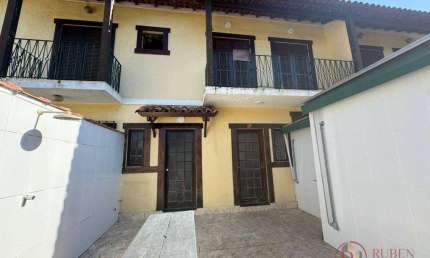 Village com 2 dormitórios à venda, 69 m² por R$ 690.000,00 - Centro - Bertioga/SP