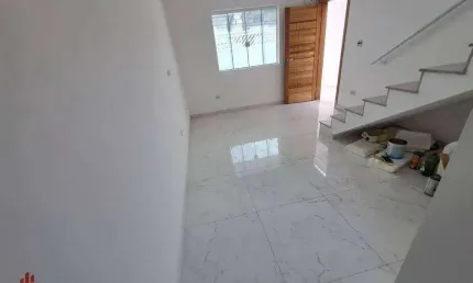 Sobrado com 3 dormitórios à venda, 104 m² por R$ 595.000,00 - tude basto - Praia Grande/SP