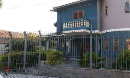 Sobrado com 4 dormitórios à venda, 710 m² por R$ 1.500.000,00 - Solemar - Praia Grande/SP